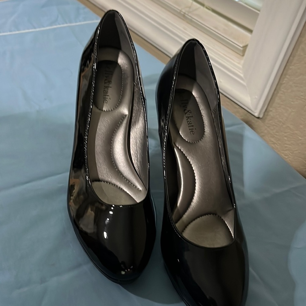 Kelly and Kate patent leather black heels with a little bit of stack.